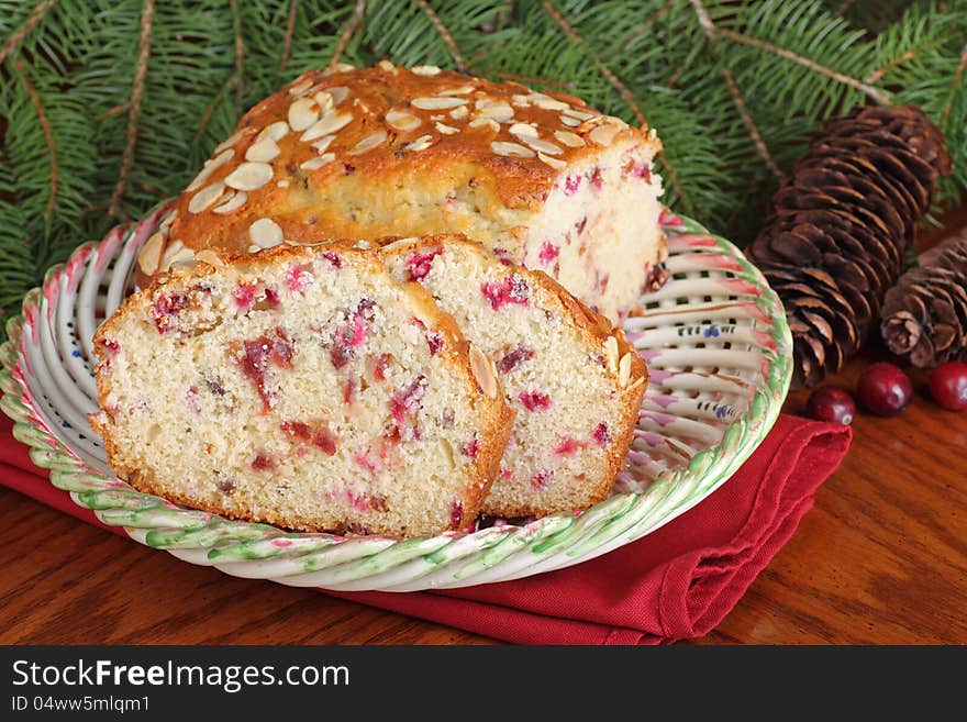 Sliced cranberry almond Christmas bread on a plate. Sliced cranberry almond Christmas bread on a plate