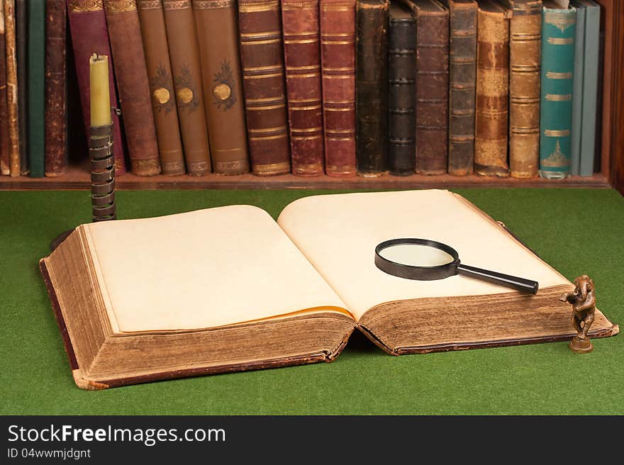 Leather Books, Candlestick, Magnifying Glass