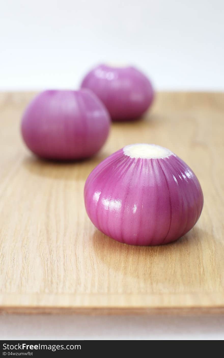 Red onion closeup on white background