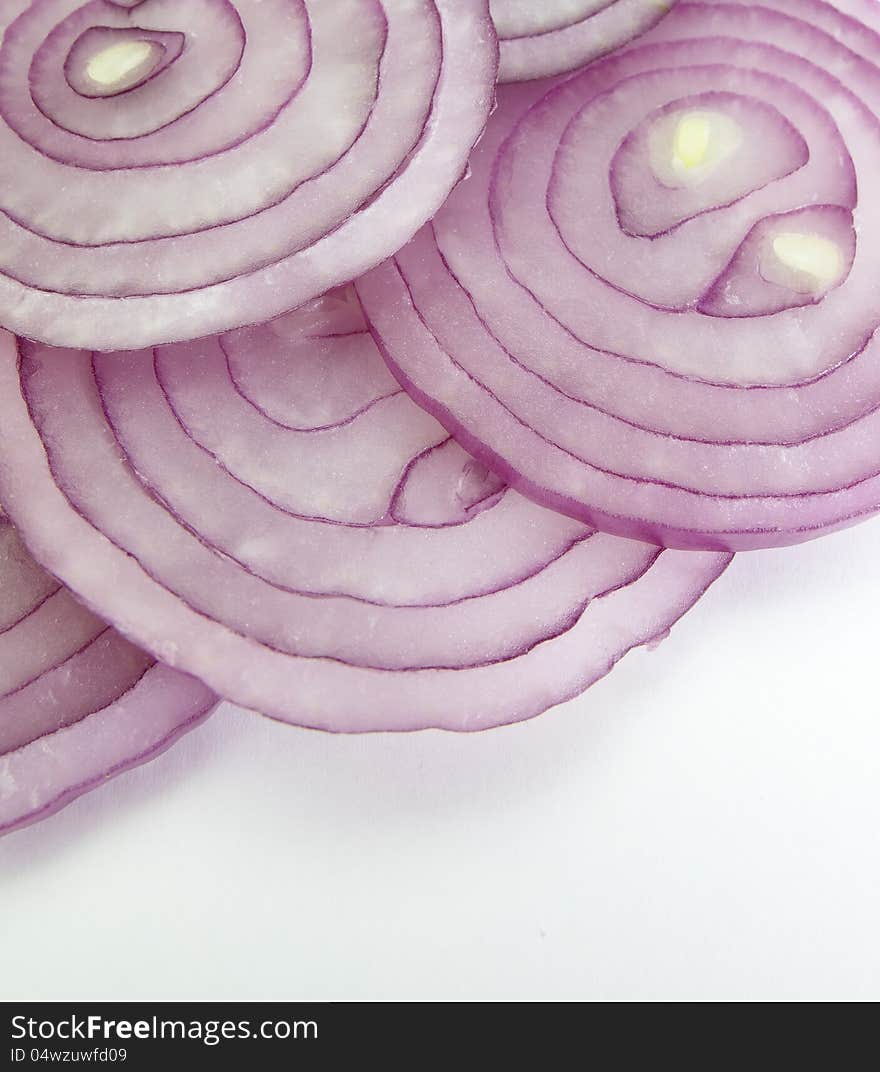 Red onion closeup on white background