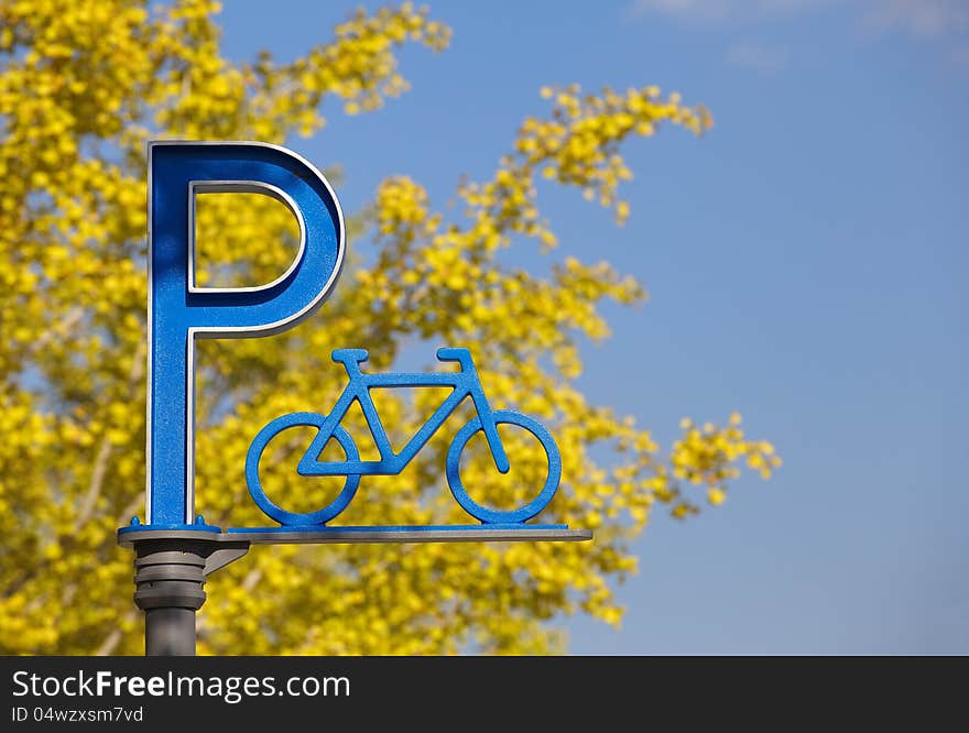 Bicycle parking with yellow leaf and blue sky