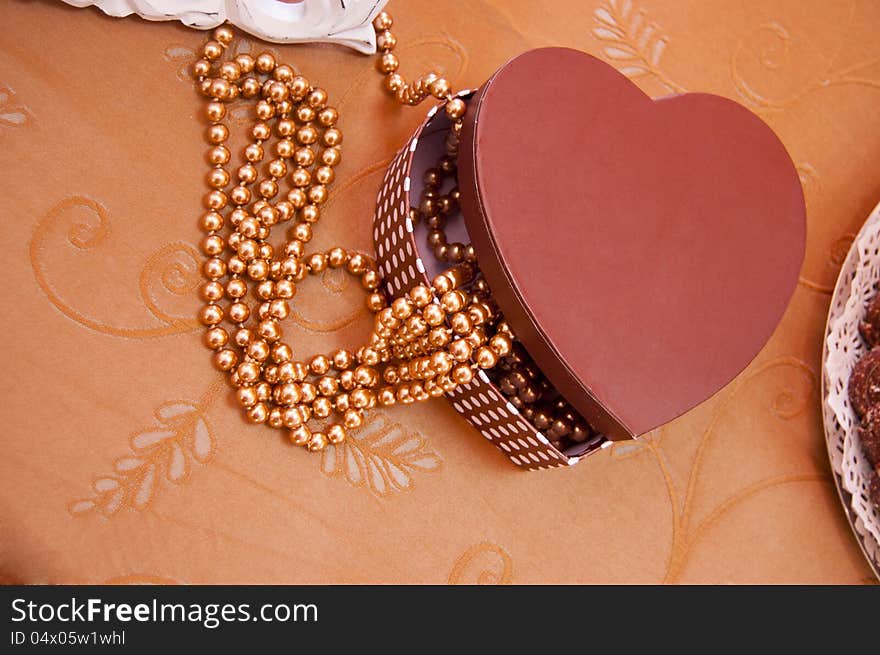 Jewelry laying out from a heart box. Jewelry laying out from a heart box.