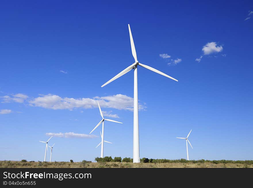 Group of windmills with cloudy sky  in Tardienta, Huesca, Aragon, Spain. Group of windmills with cloudy sky  in Tardienta, Huesca, Aragon, Spain