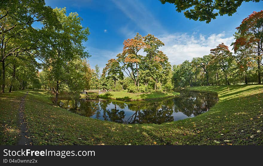 Autumn trees near the pond in the park. Autumn trees near the pond in the park