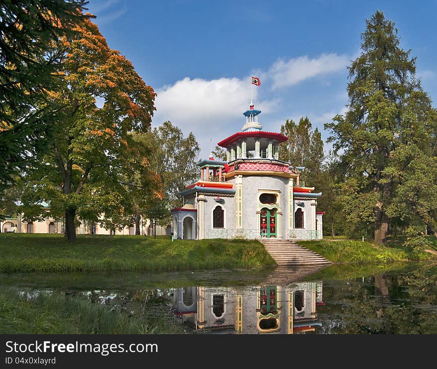 Chinese pagoda pavilion next to the autumn pond. Chinese pagoda pavilion next to the autumn pond