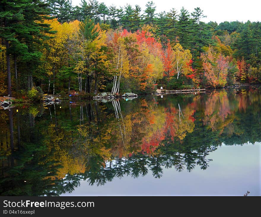 Fall foliage reflected in Lake Kanasatka, NH. Fall foliage reflected in Lake Kanasatka, NH