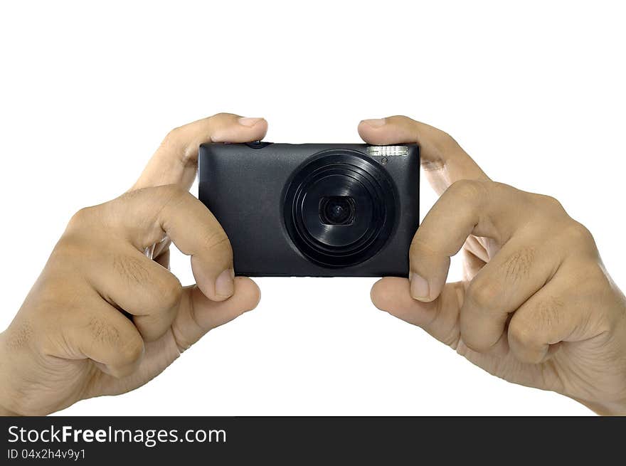 Man hand holding compact digital camera isolated over white background. Man hand holding compact digital camera isolated over white background