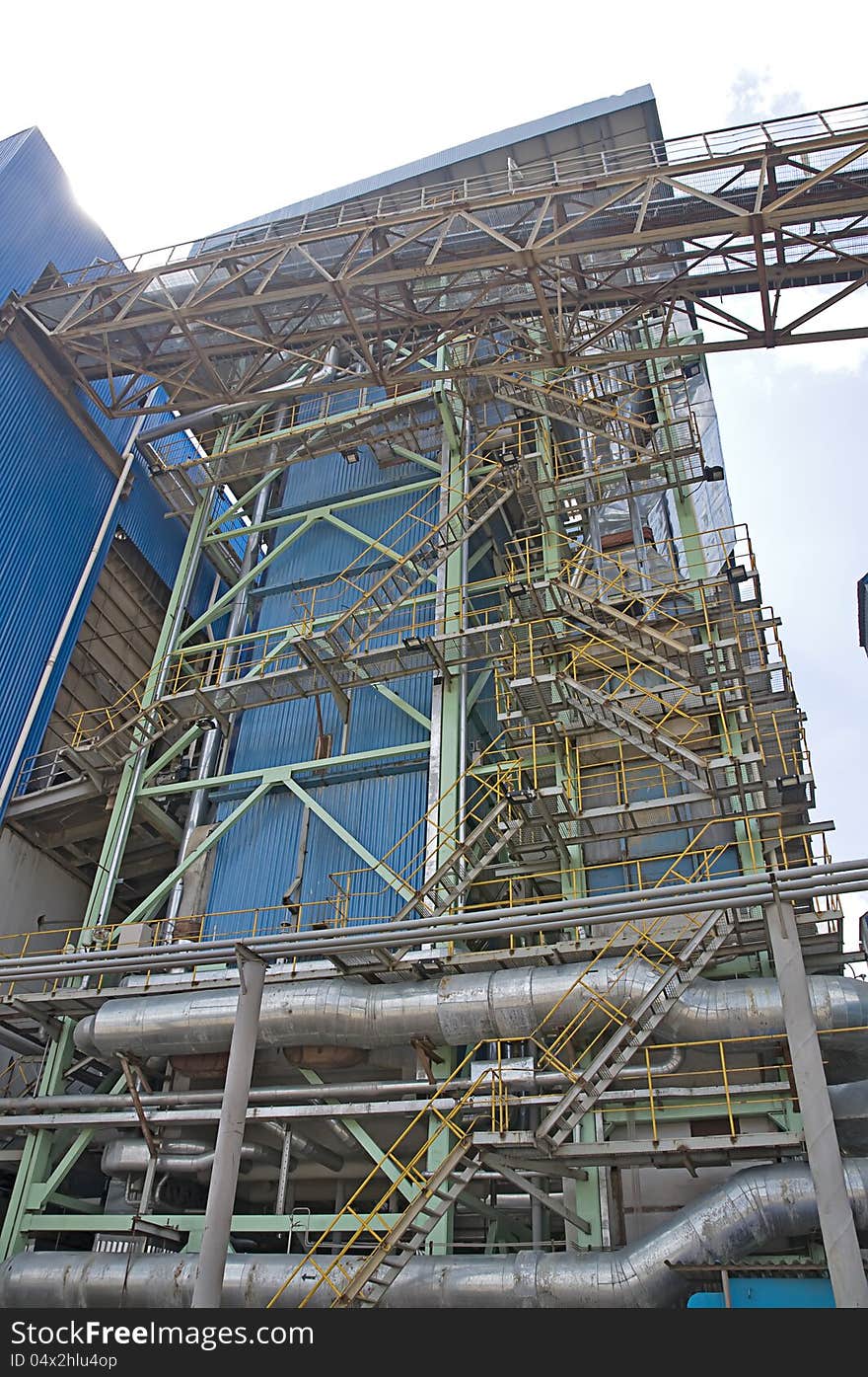 Power plant factory detail shot with blue sky background. Power plant factory detail shot with blue sky background