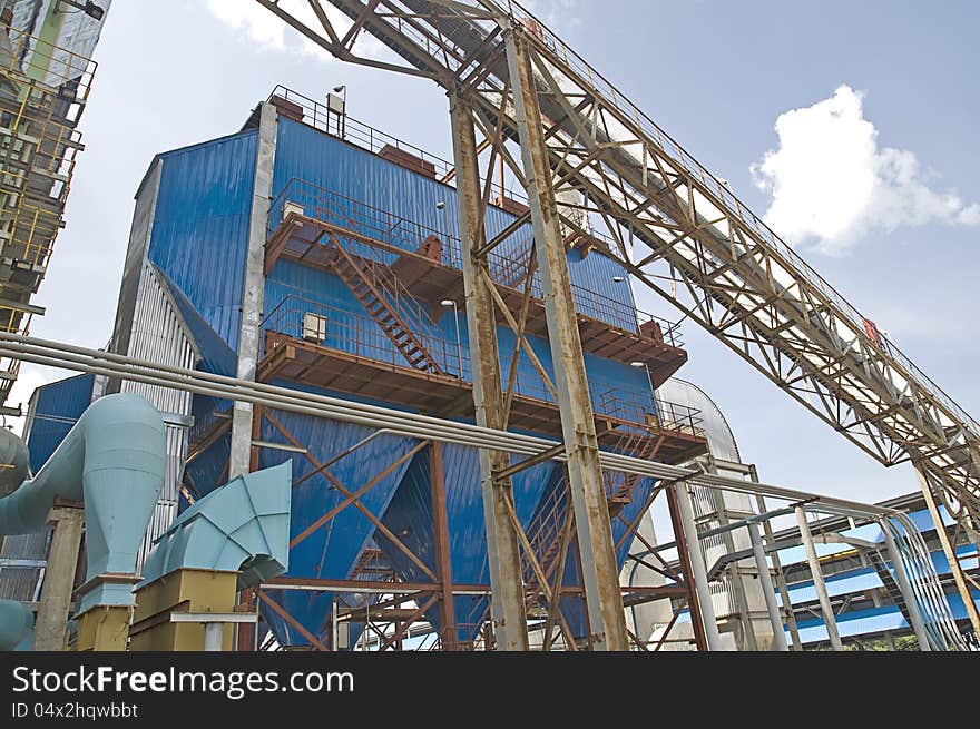 Power plant factory detail shot with blue sky background. Power plant factory detail shot with blue sky background