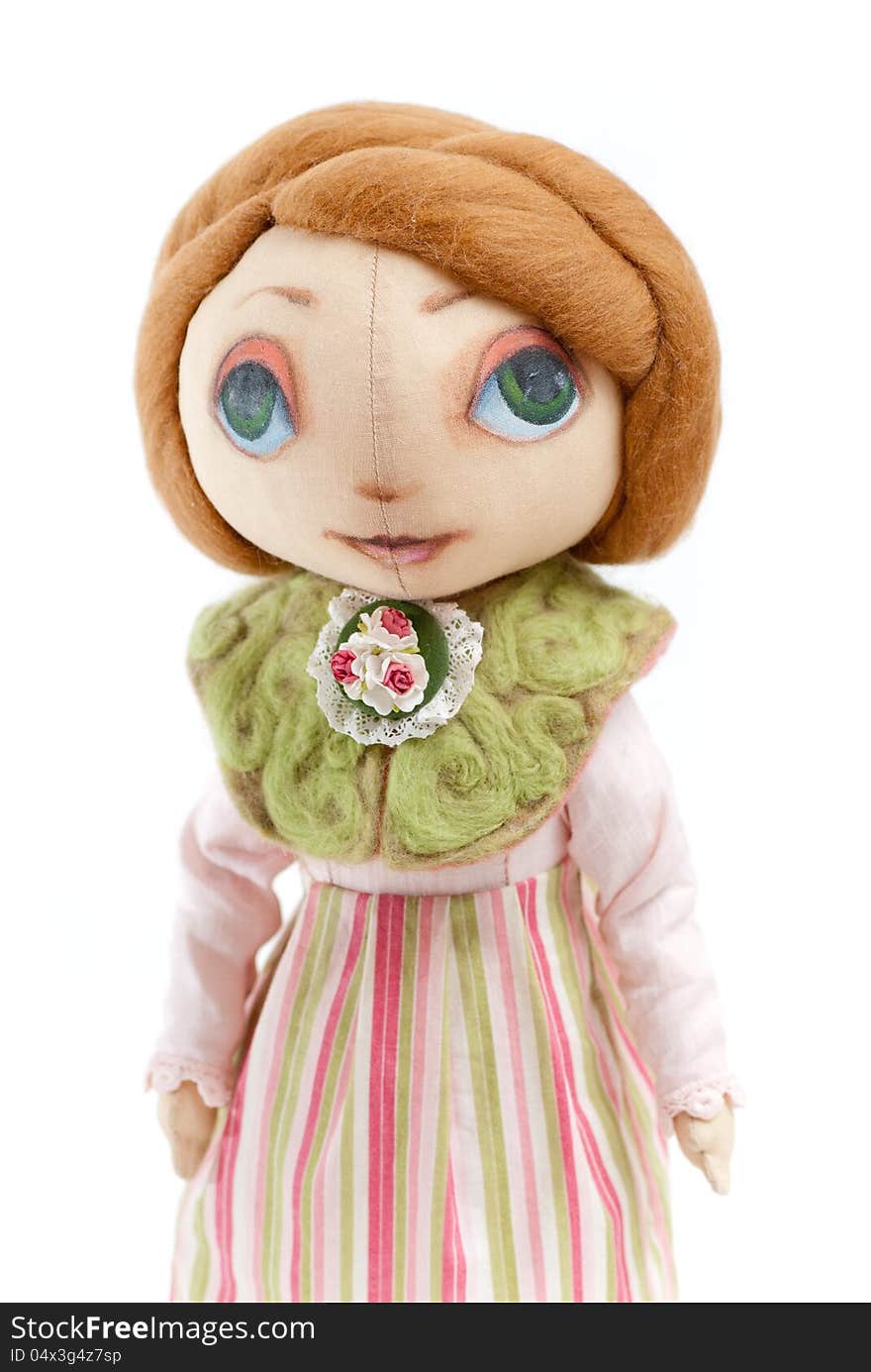 Handmade toy cute litlle girl with big eyes isolated. Handmade toy cute litlle girl with big eyes isolated