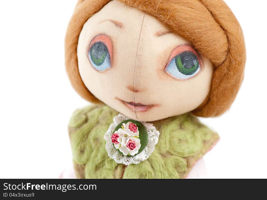 Handmade toy cute litlle girl with big eyes isolated. Handmade toy cute litlle girl with big eyes isolated