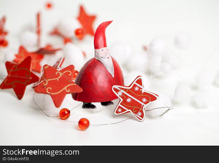 A chubby Santa Claus standing with a stars ribbon around him on white background. A chubby Santa Claus standing with a stars ribbon around him on white background