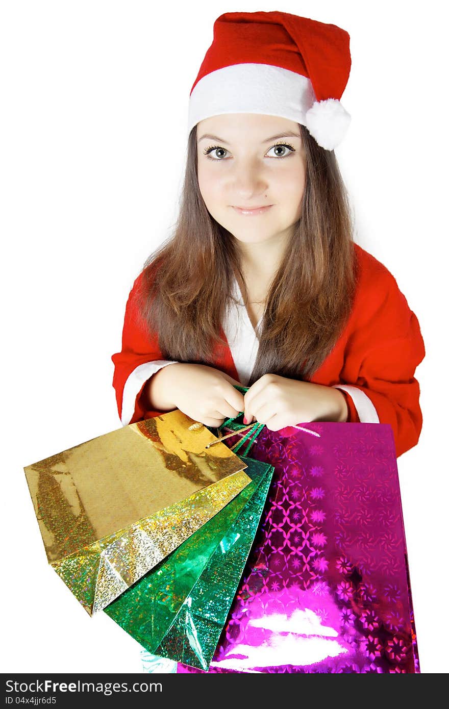 Pretty young lady dressed as Santa with presents isolated. Pretty young lady dressed as Santa with presents isolated