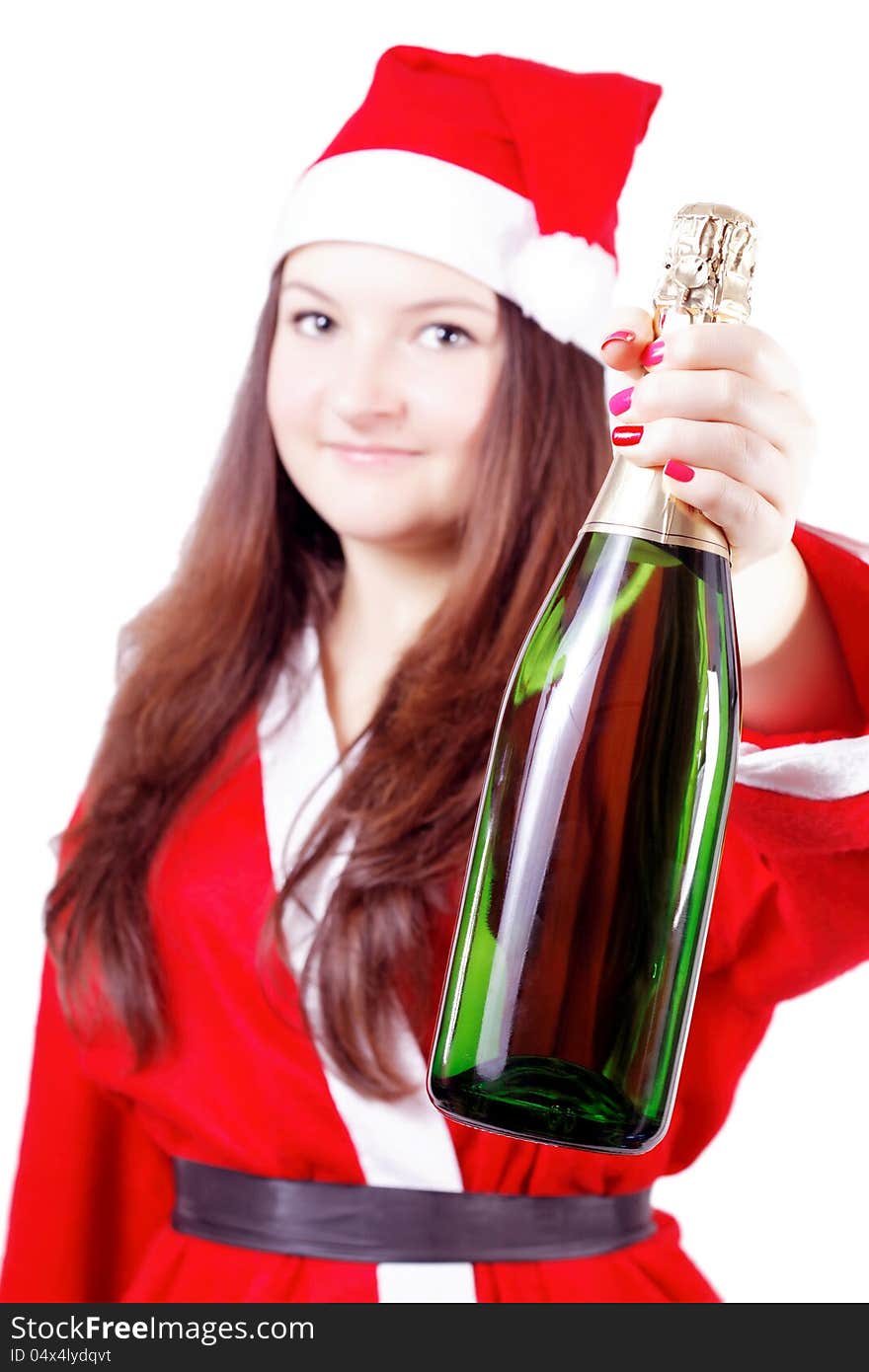 Pretty young girl dressed as Santa offers champagne isolated