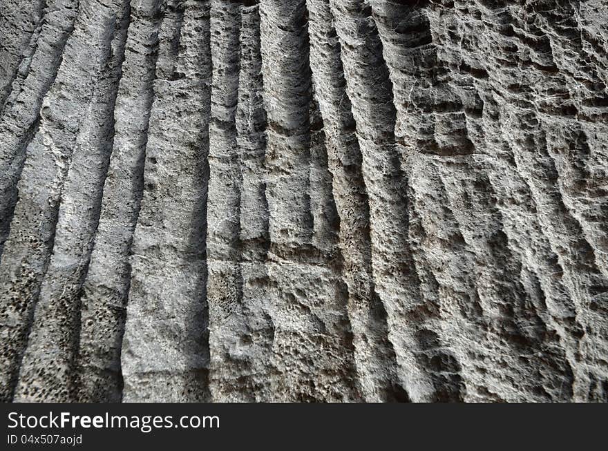 Texture of gray rock with vertical stripes. Texture of gray rock with vertical stripes