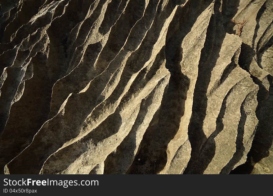 An interesting abstract gray-yellow stone cliffs. An interesting abstract gray-yellow stone cliffs