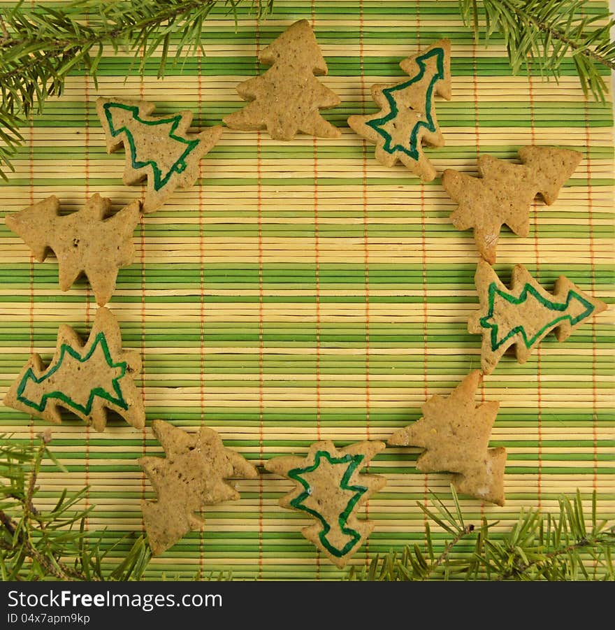 Christmas cookies in the form of circle on the green stripped background. Christmas cookies in the form of circle on the green stripped background