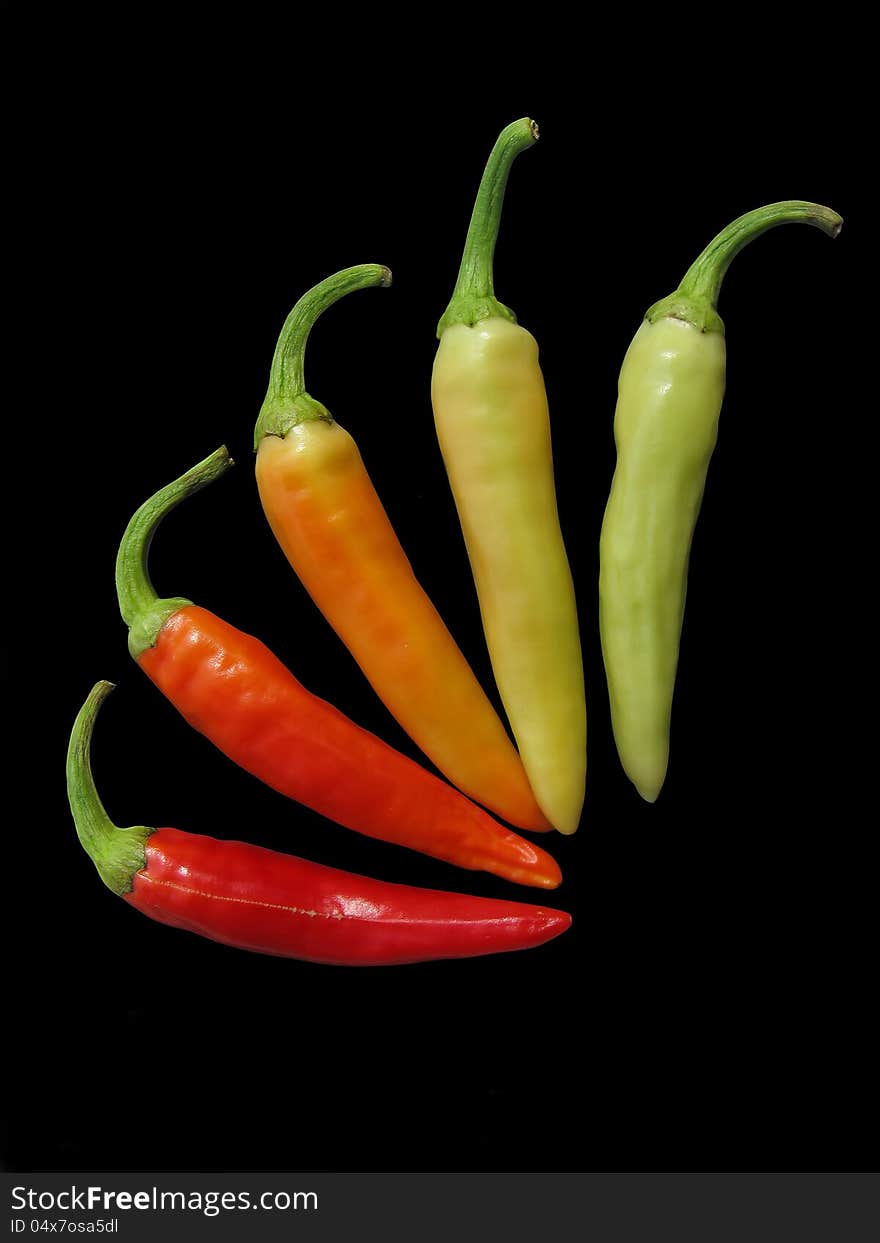 Red, gran, yellow hot chili peppers