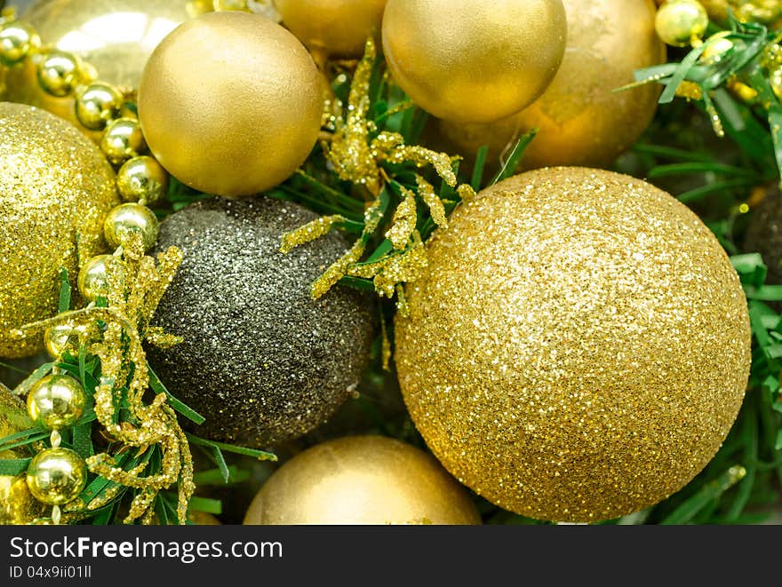 Golden Christmas balls and fir tree.