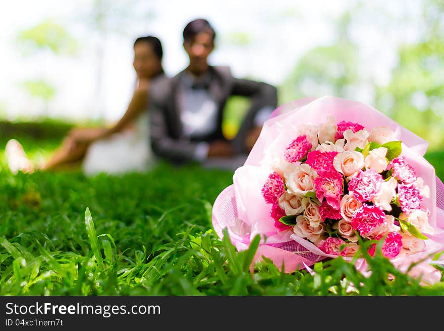 Wedding couple, with a bouquet of flowers