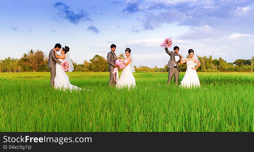 Wedding couple hugging, with a bouquet of flowers. Wedding couple hugging, with a bouquet of flowers