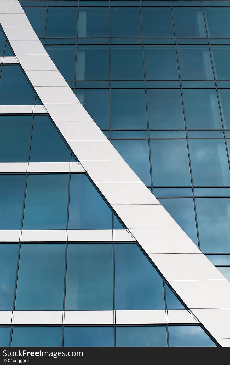 Blue sky reflected in the windows of office building. Blue sky reflected in the windows of office building