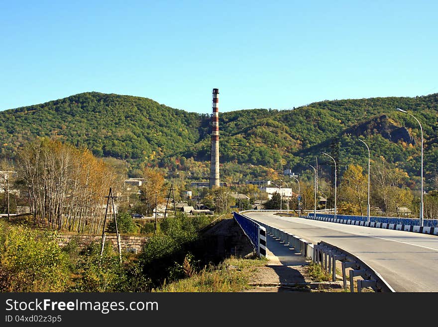 Autumn landscape of a city in mountain area. Autumn landscape of a city in mountain area