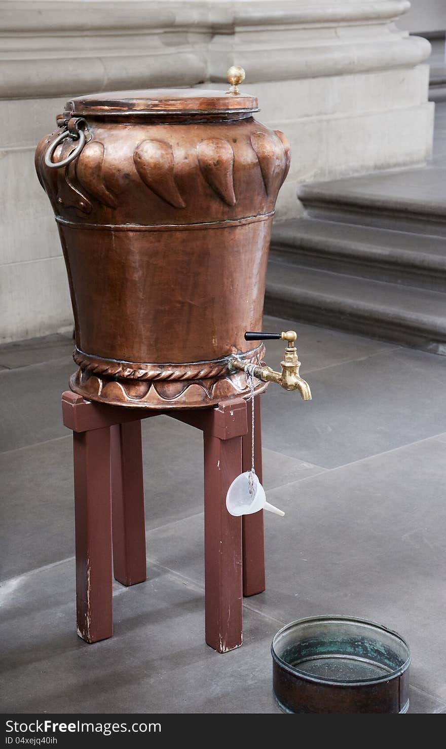 Vintage copper holy water basin in the cathedral. Vintage copper holy water basin in the cathedral