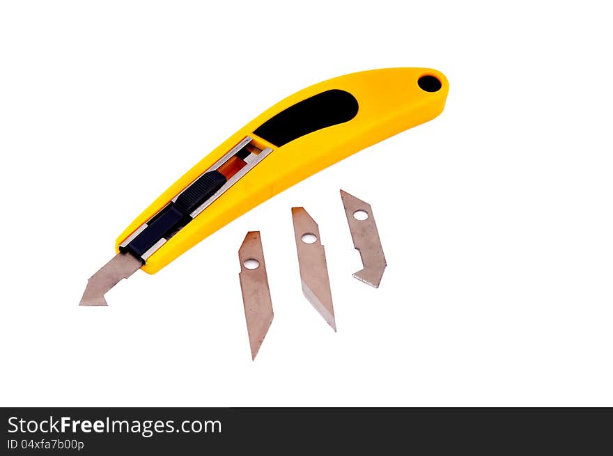 Knife with a yellow handle to work on the cardboard and plastic sheets and spare blades. Knife with a yellow handle to work on the cardboard and plastic sheets and spare blades