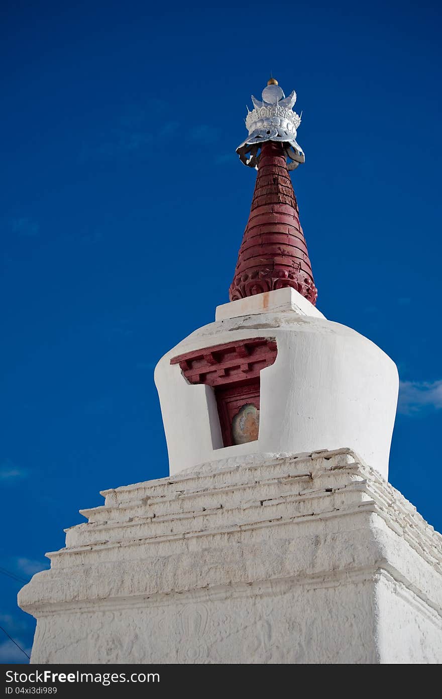 Buddhist stupa over blue sky at Thiksey Gompa