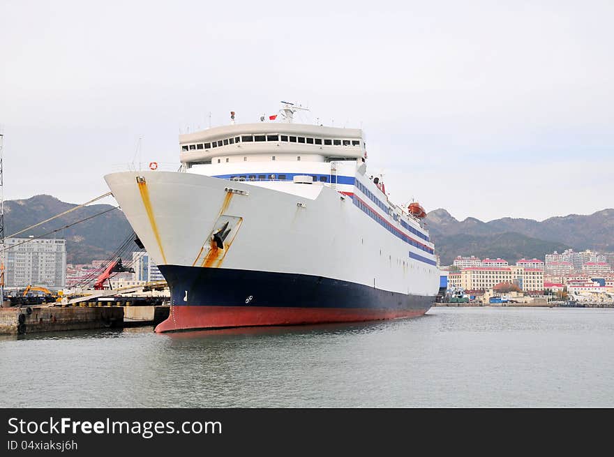 A cruise ship docked at the shore. A cruise ship docked at the shore