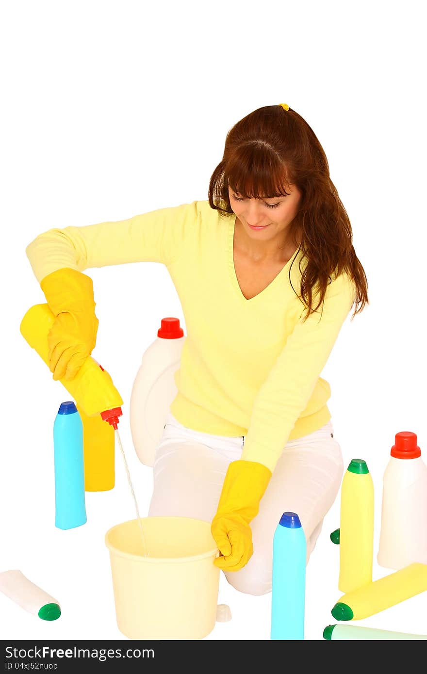 Woman preparing to clean using plastic bottles and bucket isolated on a white background. Woman preparing to clean using plastic bottles and bucket isolated on a white background