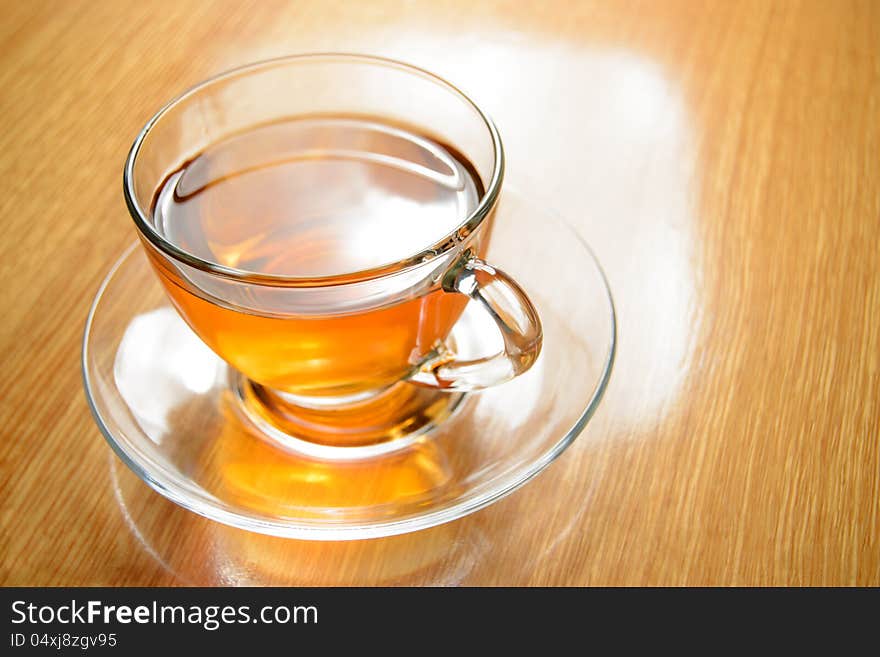 Glass Cup of Green Tea on the Wooden Table