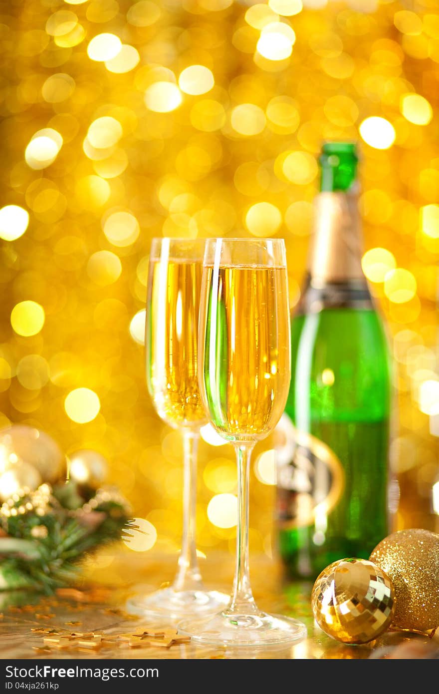 Two glassesof champagne with a Christmas decor in the background. very shallow depth of field, focus on near glass.