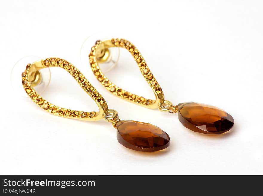 Pair of classy gold earrings with a big stone. Pair of classy gold earrings with a big stone.