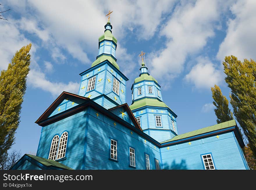 Old wooden Ukrainian church on a background of blue sky. Old wooden Ukrainian church on a background of blue sky