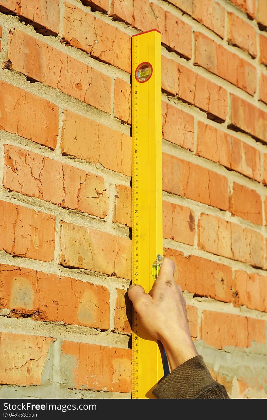 Measure the level of the wall construction. Measure the level of the wall construction