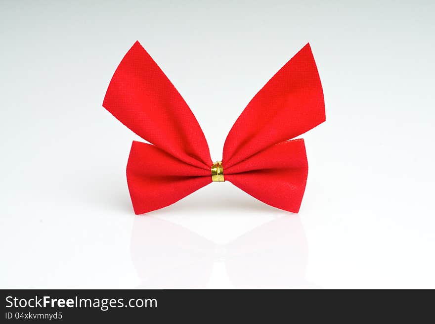 A red ribbon bow on white background