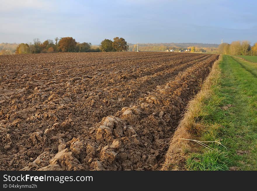 Field of freshly turned topsoil forming large clods of earth. Field of freshly turned topsoil forming large clods of earth