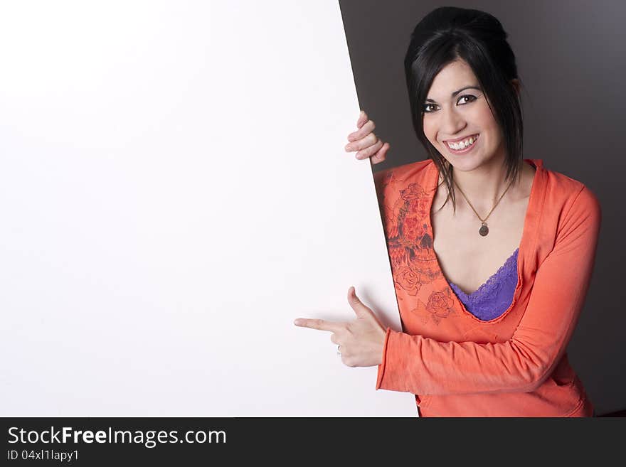 Sales Woman Points to Blank Area White Board