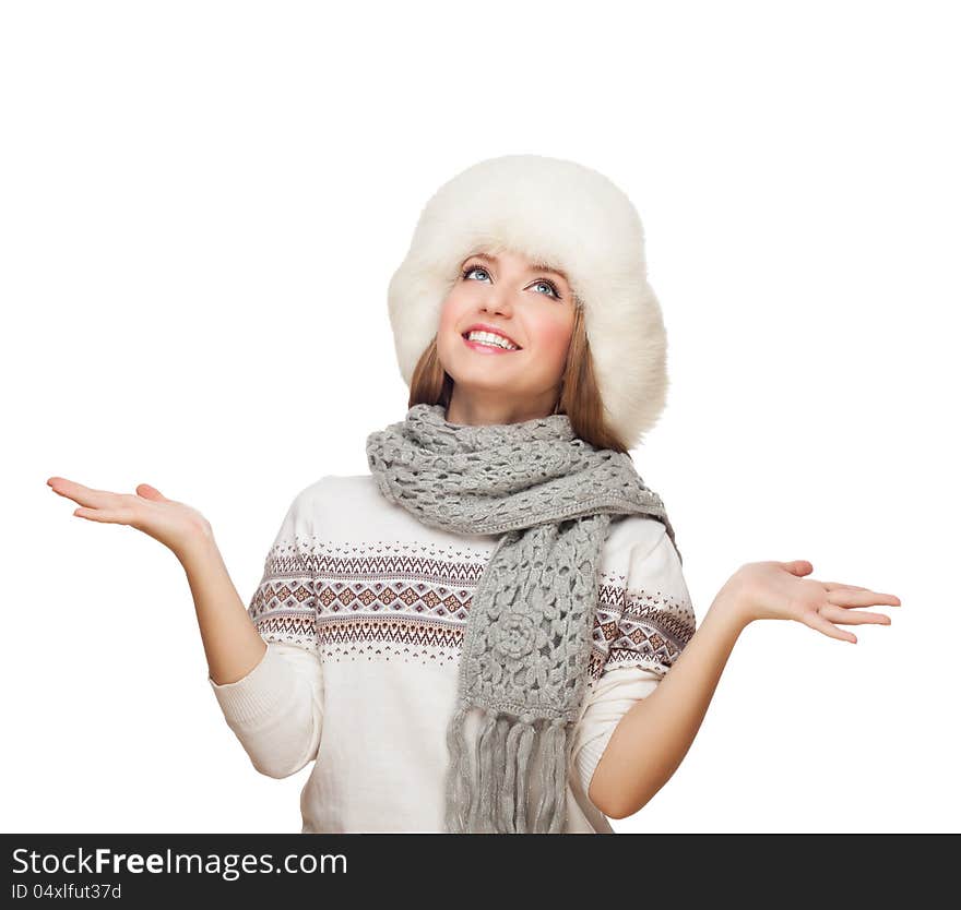 Young woman lifts hands, looks up