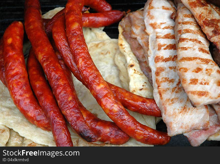 Grilled pork, chicken and saussage. Grilled pork, chicken and saussage