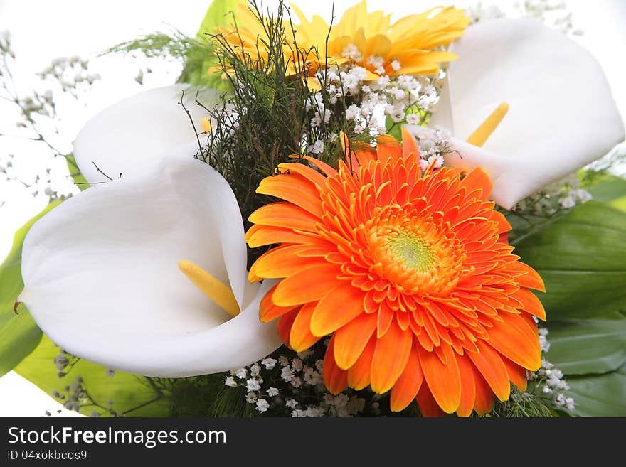 Bright bouquet shot from above, close-up. Calla and Gerbera flowers