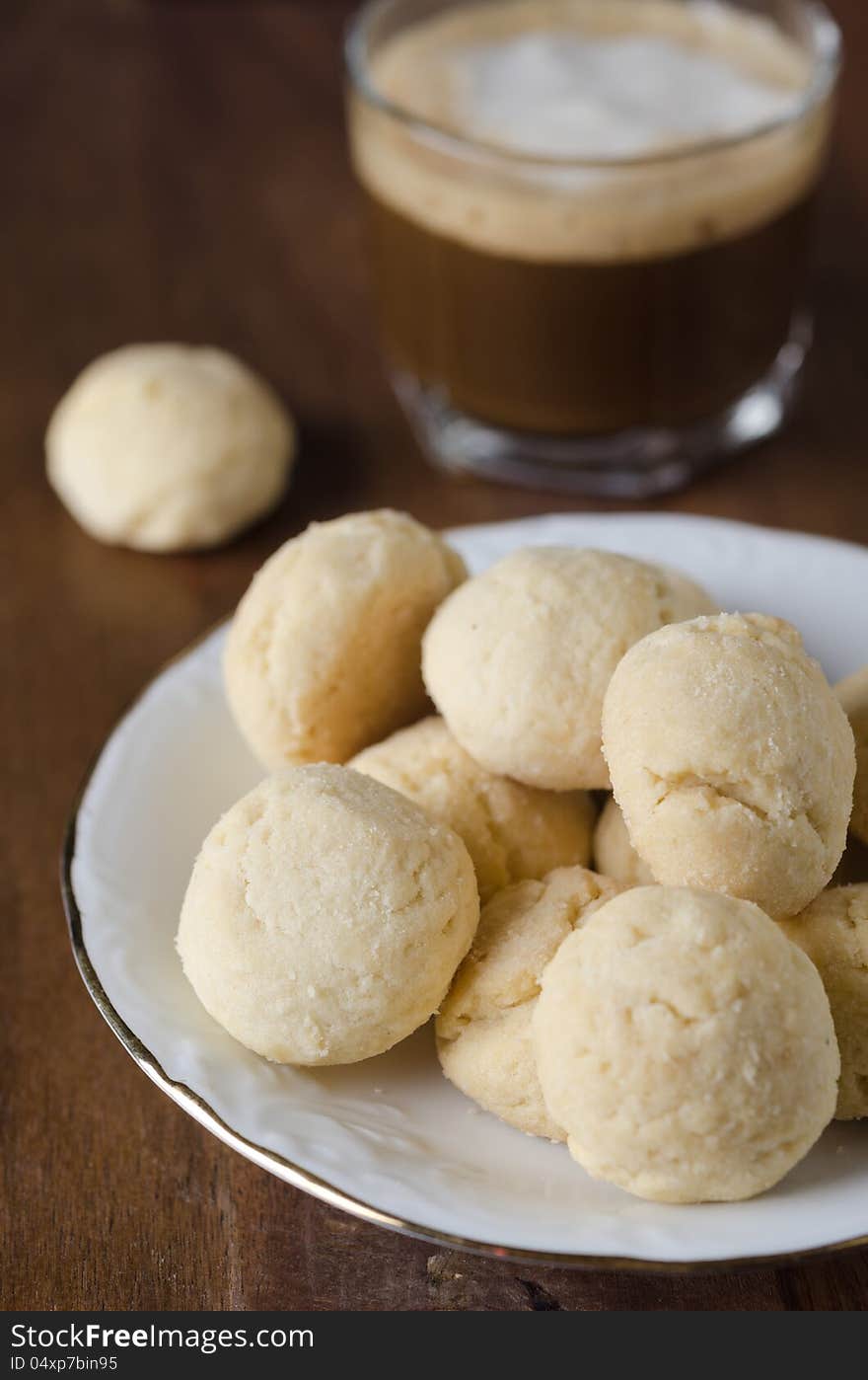 Mini shortbread biscuits and coffee closeup