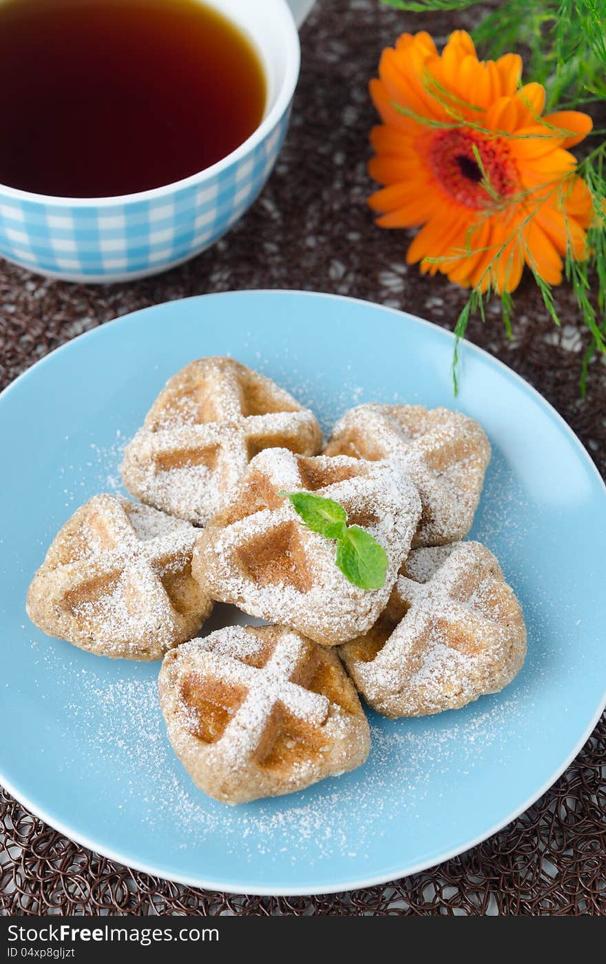 Waffles sprinkled with powdered sugar