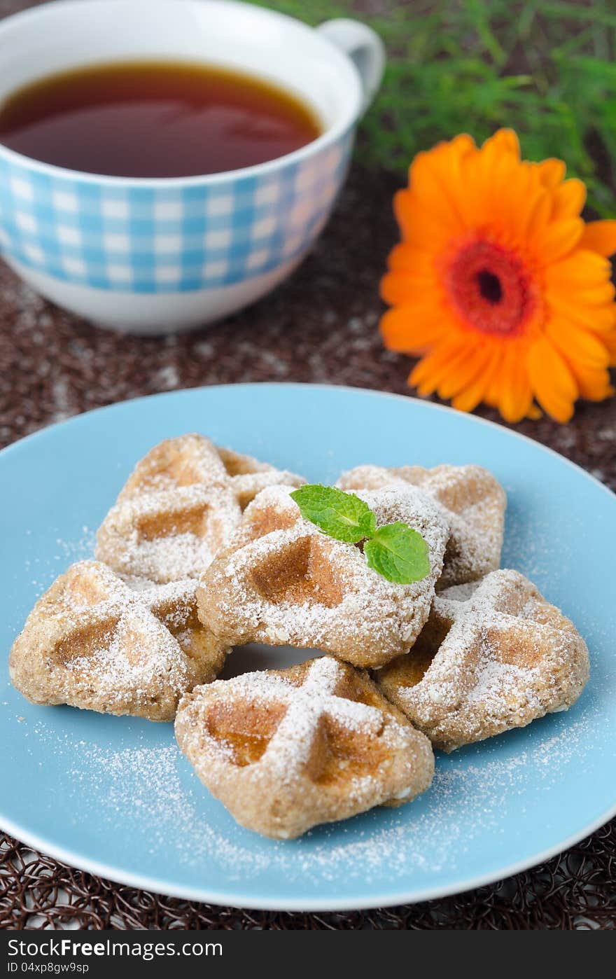 Waffles sprinkled with powdered sugar