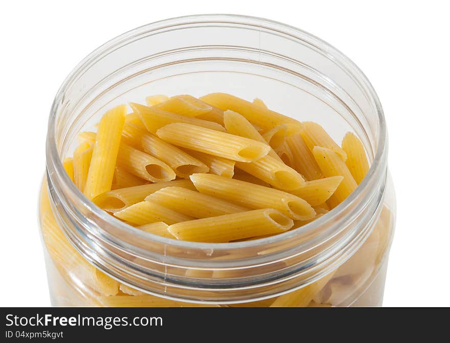 Pasta in the glass jar on white background. Pasta in the glass jar on white background