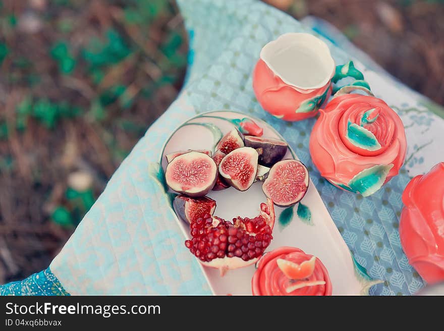 Still life - red, juicy pomegranate and fresh, ripe figs. Still life - red, juicy pomegranate and fresh, ripe figs