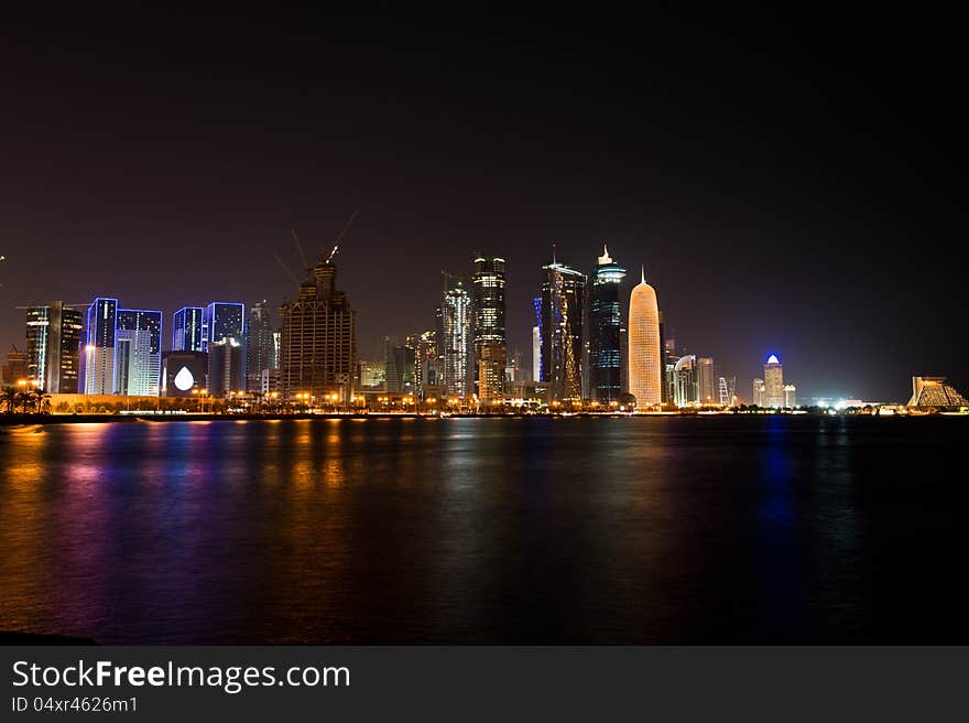 Slow shutter night time shot of the Doha West Bay area across the corniche. Slow shutter night time shot of the Doha West Bay area across the corniche.