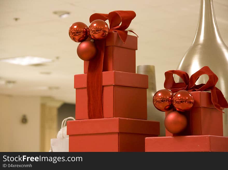 Beautiful red Christmas boxes with a vase background. Beautiful red Christmas boxes with a vase background